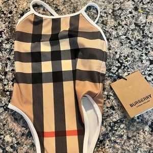 One piece baby girl bathing suit. Never worn with tags